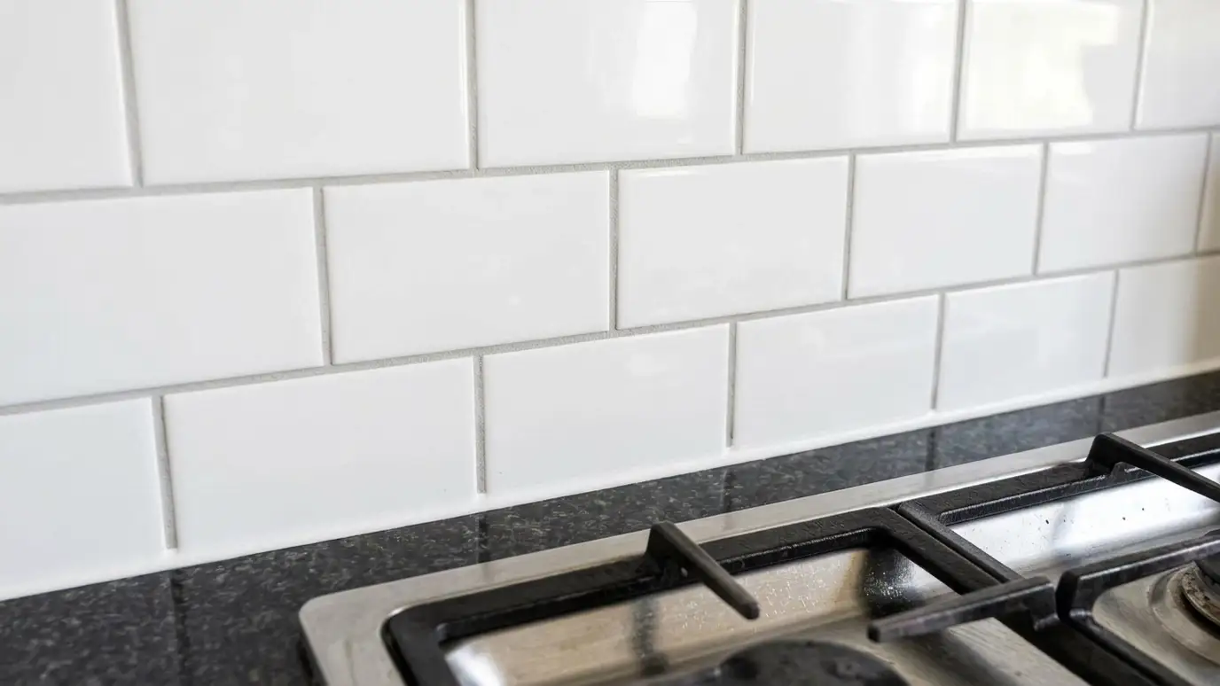 After: Backsplash grout and caulk refreshed | Music City Grout After: a kitchen backsplash with clean light gray grout and a neat new caulk line