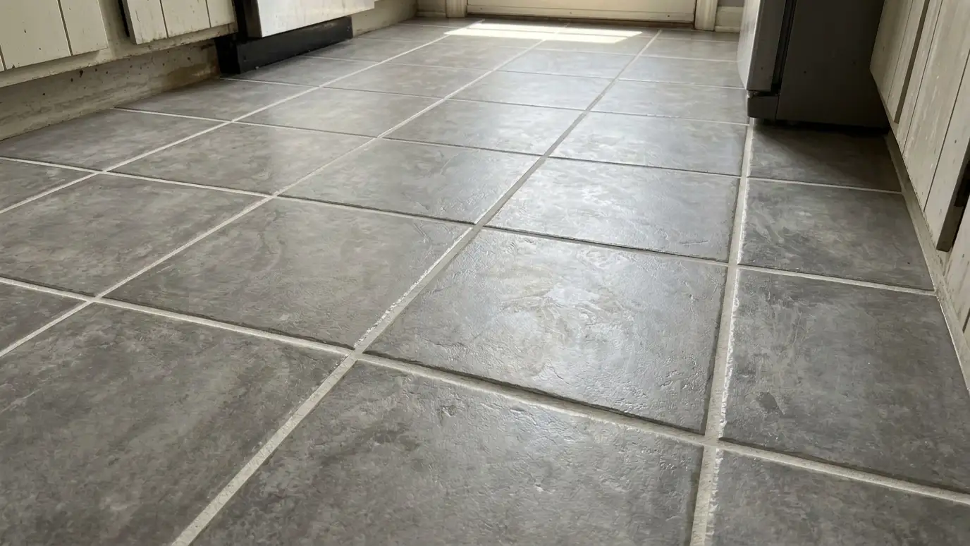 After: a kitchen floor with clean, light grout lines and a bright surface